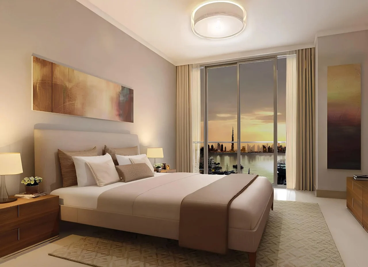 Dubai Creek Residences at Dubai Creek Harbour by Emaar Properties contemporary bedroom with floor to ceiling windows and waterfront skyline view in Dubai Presented by Tohid Fetrat