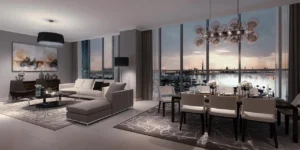 Dubai Creek Residences at Dubai Creek Harbour by Emaar Properties elegant living and dining area with floor to ceiling windows overlooking the waterfront and Dubai skyline in Dubai Presented by Tohid Fetrat
