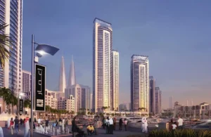 Dubai Creek Residences at Dubai Creek Harbour by Emaar Properties marina promenade with residential towers, yachts, waterfront boulevard, and Dubai skyline in Dubai Presented by Tohid Fetrat
