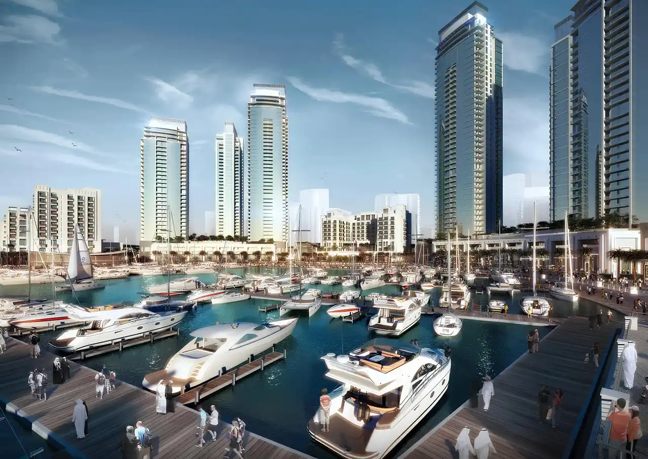 Dubai Creek Residences at Dubai Creek Harbour by Emaar Properties luxury marina with yachts, waterfront residential towers, and promenade in Dubai Presented by Tohid Fetrat