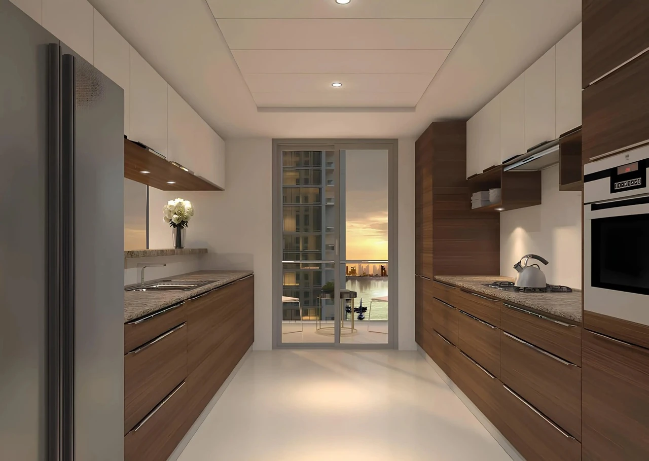 Dubai Creek Residences at Dubai Creek Harbour by Emaar Properties modern kitchen with premium cabinetry, built in appliances, and balcony waterfront view in Dubai Presented by Tohid Fetrat