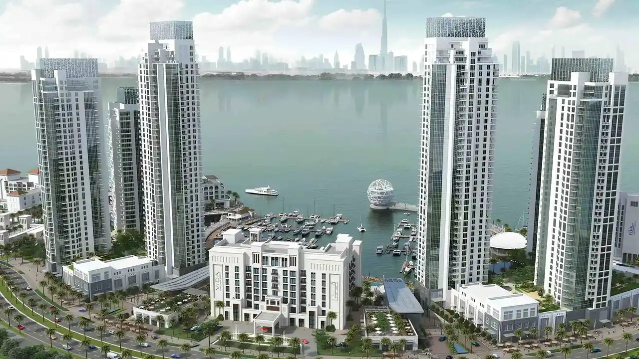 Dubai Creek Residences at Dubai Creek Harbour by Emaar Properties aerial waterfront view showcasing residential towers, marina, and Dubai skyline in Dubai Presented by Tohid Fetrat