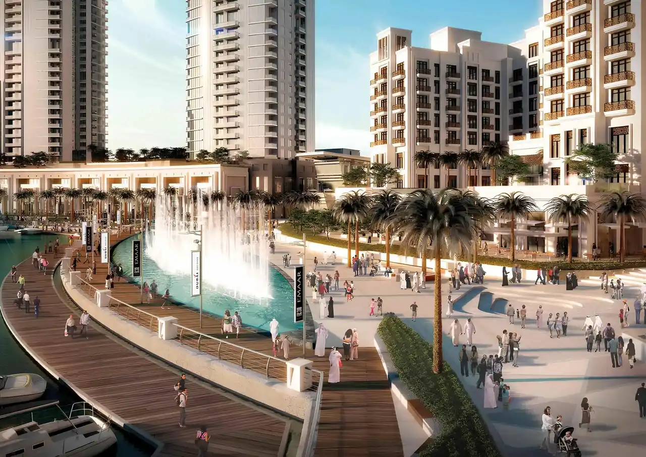 Dubai Creek Residences at Dubai Creek Harbour by Emaar Properties waterfront promenade with dancing fountain, landscaped plaza, and residential towers in Dubai Presented by Tohid Fetrat