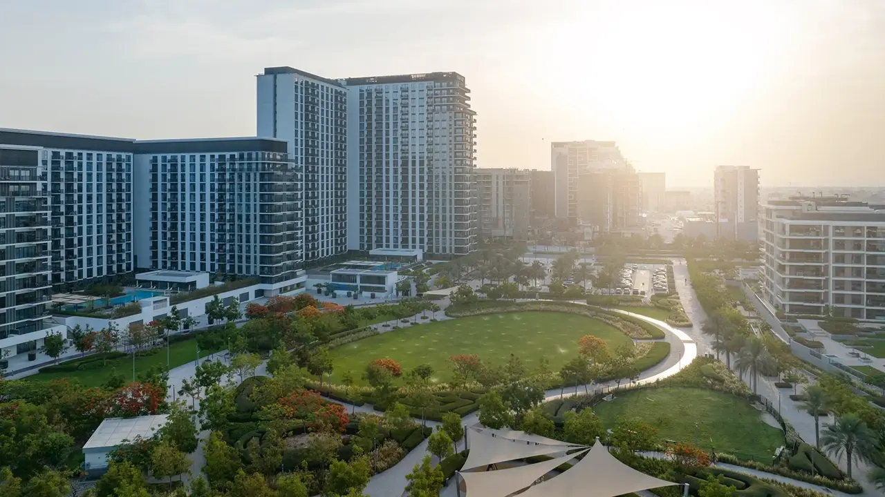 Dubai Hills Estate properties for sale overlooking the central park with modern residential buildings landscaped green spaces and premium apartments in Dubai Presented by Tohid Fetrat