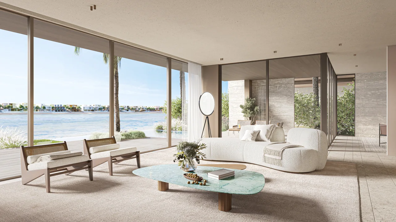 Frond A by Nakheel in Palm Jebel Ali Cobalt villa living room with curved seating sculptural coffee table and full height waterfront glazing in Dubai - Presented by Tohid Fetrat