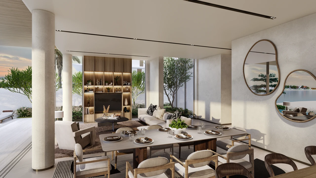 Frond A by Nakheel in Palm Jebel Ali Wave Crest villa dining and living area with organic wall mirrors stone columns and shaded courtyard outlook in Dubai - Presented by Tohid Fetrat