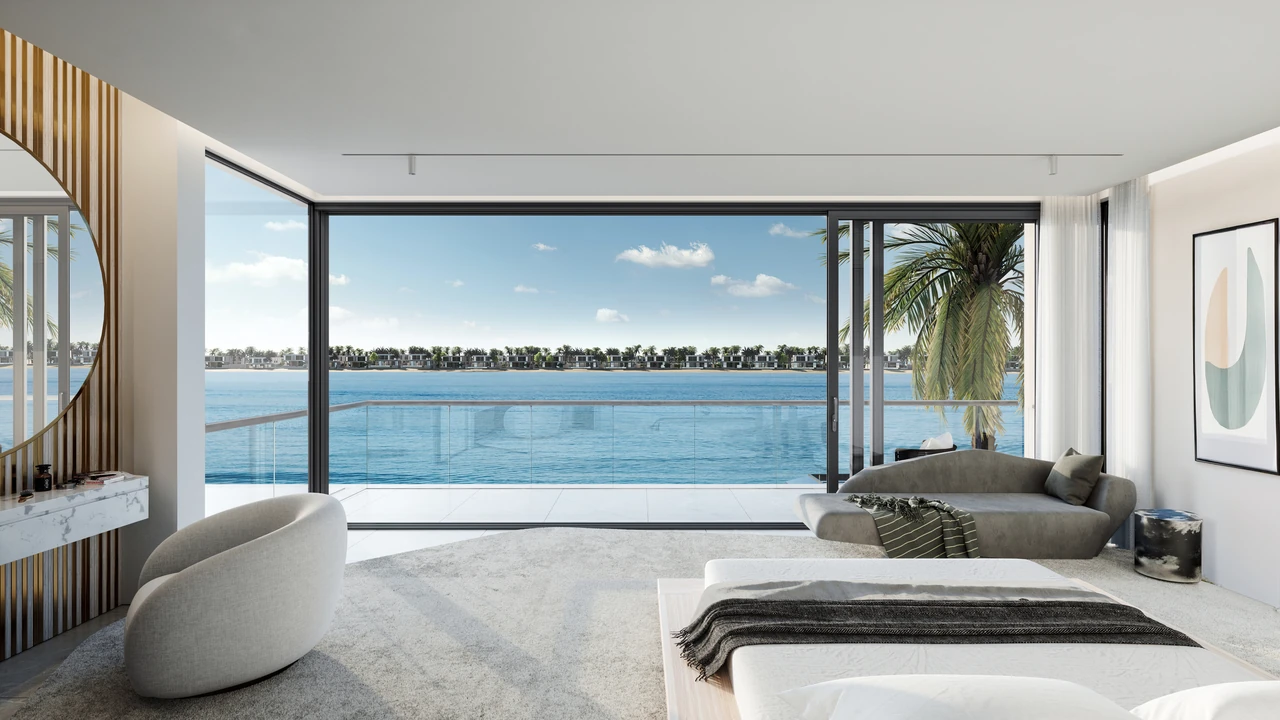 Frond A by Nakheel in Palm Jebel Ali Red Aurora villa bedroom with dressing area round mirror curved seating and full height glazing to the water in Dubai - Presented by Tohid Fetrat