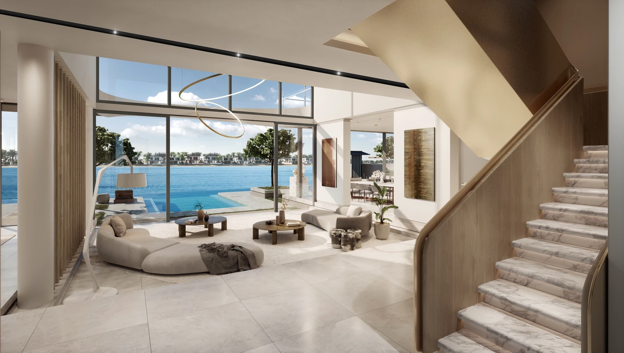Frond A by Nakheel in Palm Jebel Ali Red Aurora villa living room with curved sculptural staircase double height glazing and pool and water view in Dubai - Presented by Tohid Fetrat