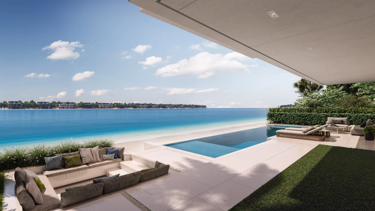 Frond F by Nakheel in Palm Jebel Ali Blue Jay villa poolside deck with loungers shaded terrace and open water views in Dubai - Presented by Tohid Fetrat