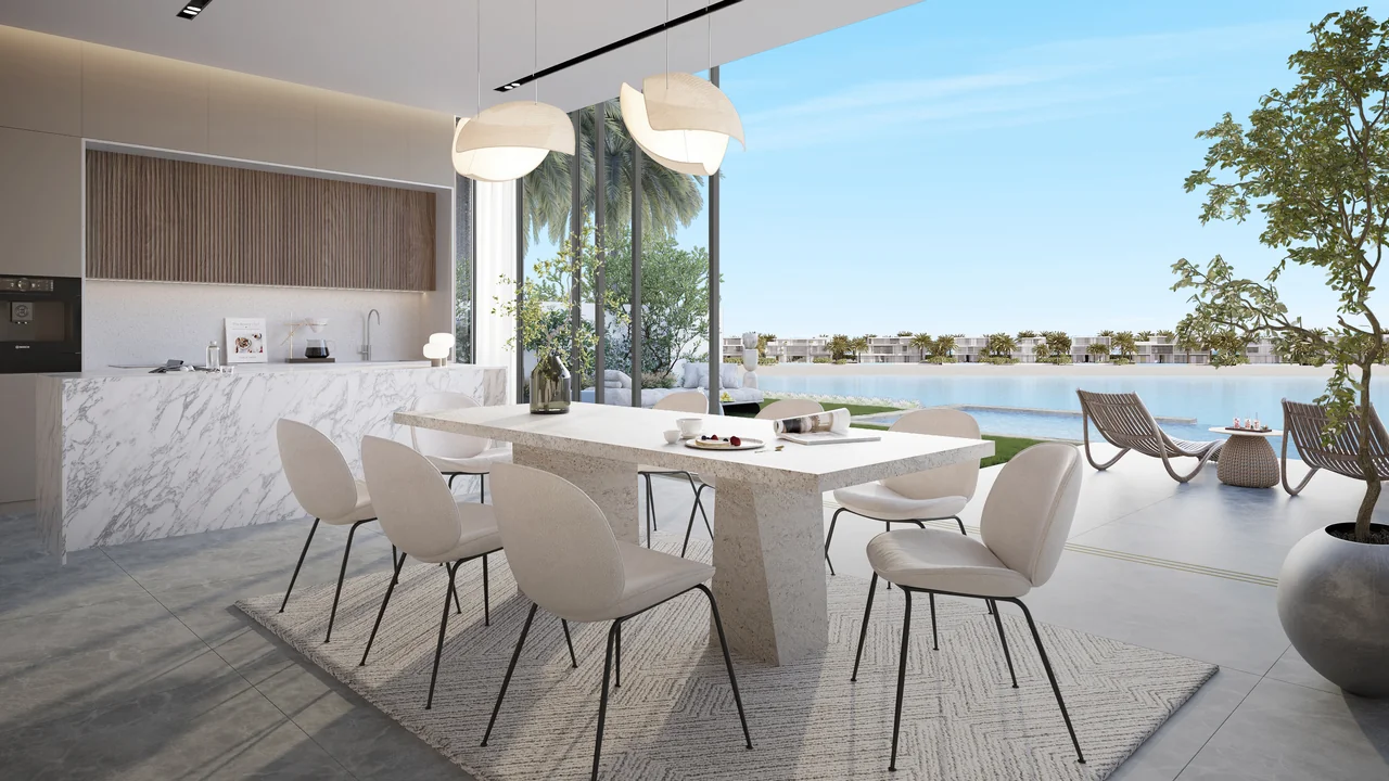 Frond F by Nakheel in Palm Jebel Ali Cyan Sky villa dining and kitchen space with island counter integrated storage and natural light in Dubai - Presented by Tohid Fetrat
