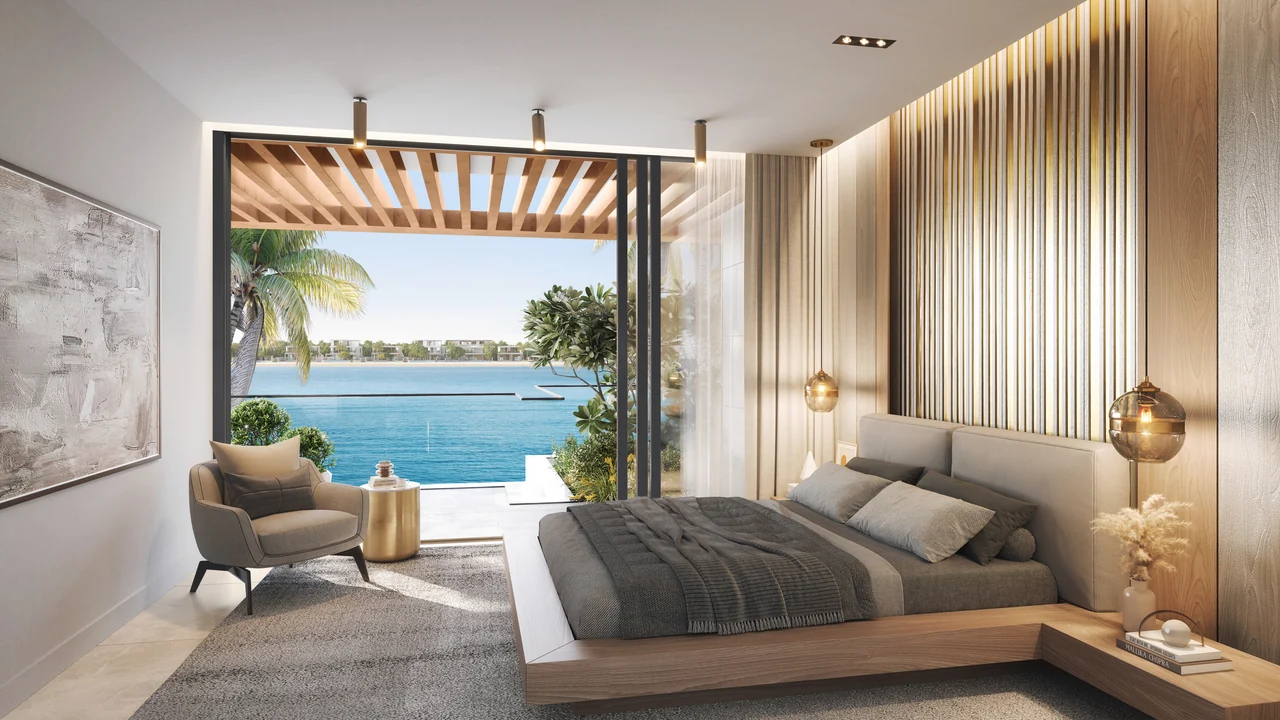 Frond F by Nakheel in Palm Jebel Ali Ocean Whisper villa primary bedroom with terrace access soft neutral finishes and open water outlook in Dubai - Presented by Tohid Fetrat