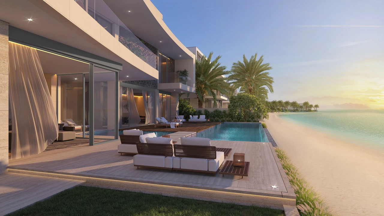 Frond F by Nakheel in Palm Jebel Ali Coral Dune villa pool and lounge terrace with outdoor seating shade structure and beach beyond in Dubai - Presented by Tohid Fetrat