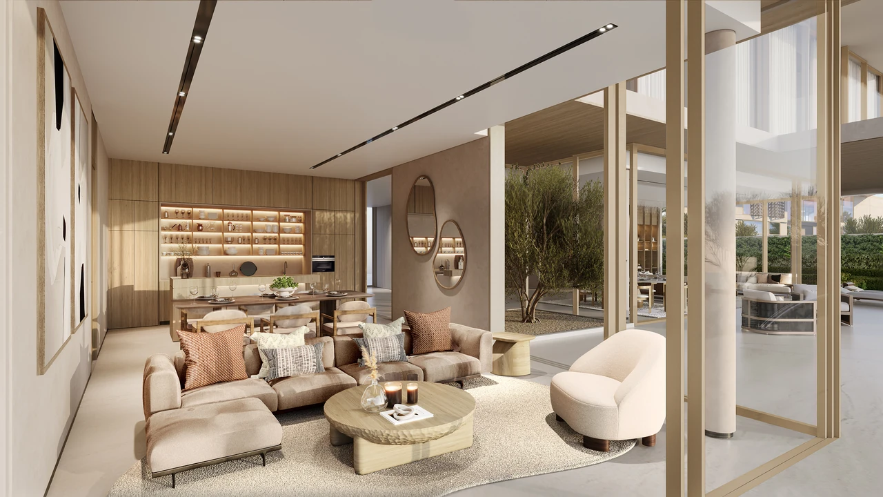 Frond F by Nakheel in Palm Jebel Ali Redwood villa living and dining space with continuous flooring soft seating and glazed sea outlook in Dubai - Presented by Tohid Fetrat