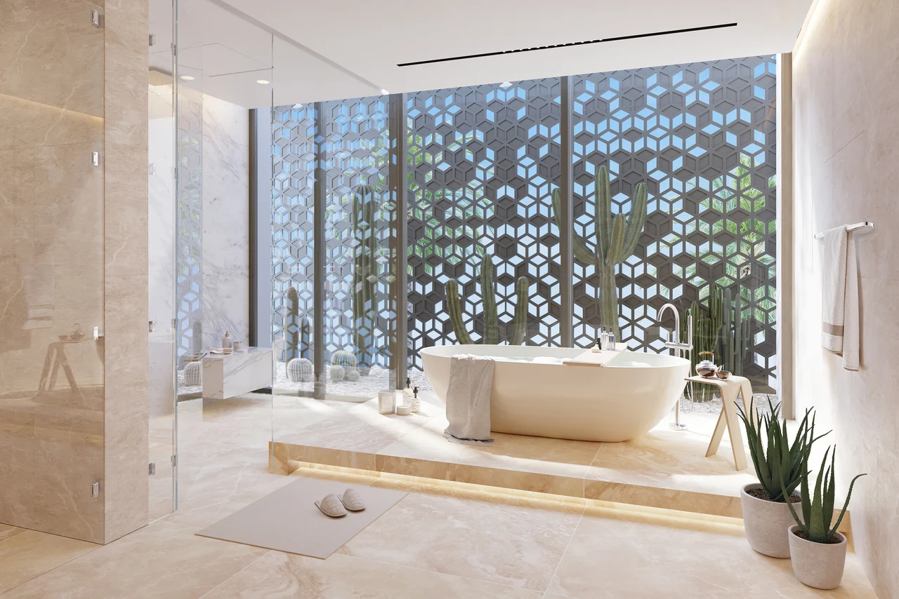 Frond F by Nakheel in Palm Jebel Ali Sunset Mirage villa bathroom with patterned screen freestanding tub and soft daylight in Dubai - Presented by Tohid Fetrat