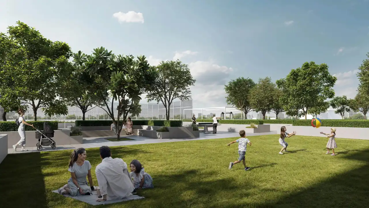 Golf Trails at Emaar South by Emaar Properties landscaped community park with open green lawn shaded seating areas and family recreation spaces in Dubai Presented by Tohid Fetrat