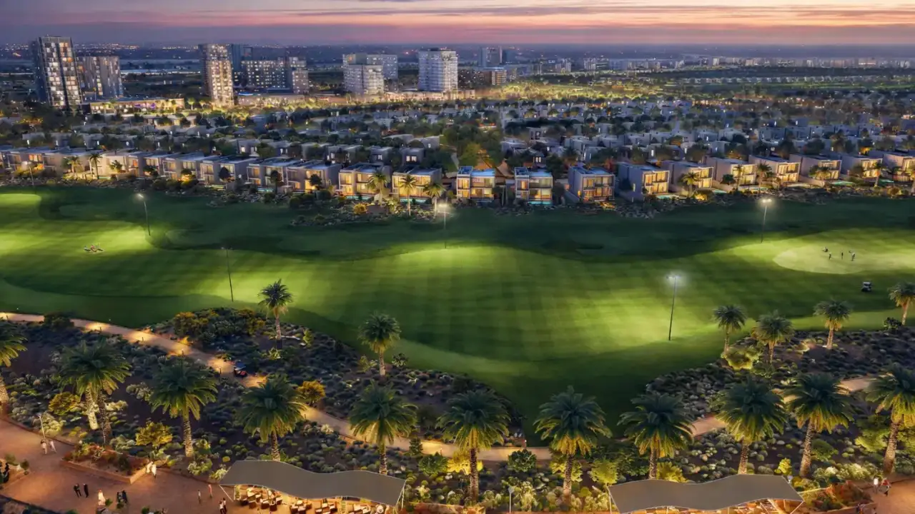 Golf Trails at Emaar South by Emaar Properties illuminated championship golf course with luxury residences and the master planned community at sunset in Dubai Presented by Tohid Fetrat