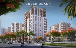 Lotus at Dubai Creek Harbour by Emaar Properties featuring the exterior of contemporary residential buildings surrounded by landscaped gardens, palm trees, and vibrant flowering trees in Dubai Presented by Tohid Fetrat