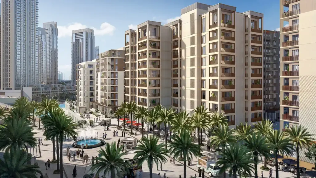 Lotus at Dubai Creek Harbour by Emaar Properties overlooking the landscaped community plaza with residential buildings, palm trees, and a central fountain in Dubai Presented by Tohid Fetrat