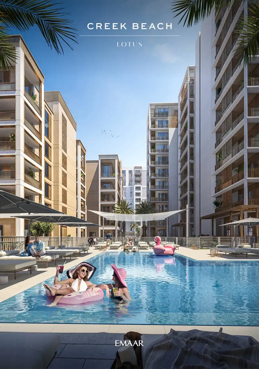 Lotus at Dubai Creek Harbour by Emaar Properties featuring the outdoor swimming pool with sun loungers, landscaped pool deck, and contemporary residential buildings in Dubai Presented by Tohid Fetrat