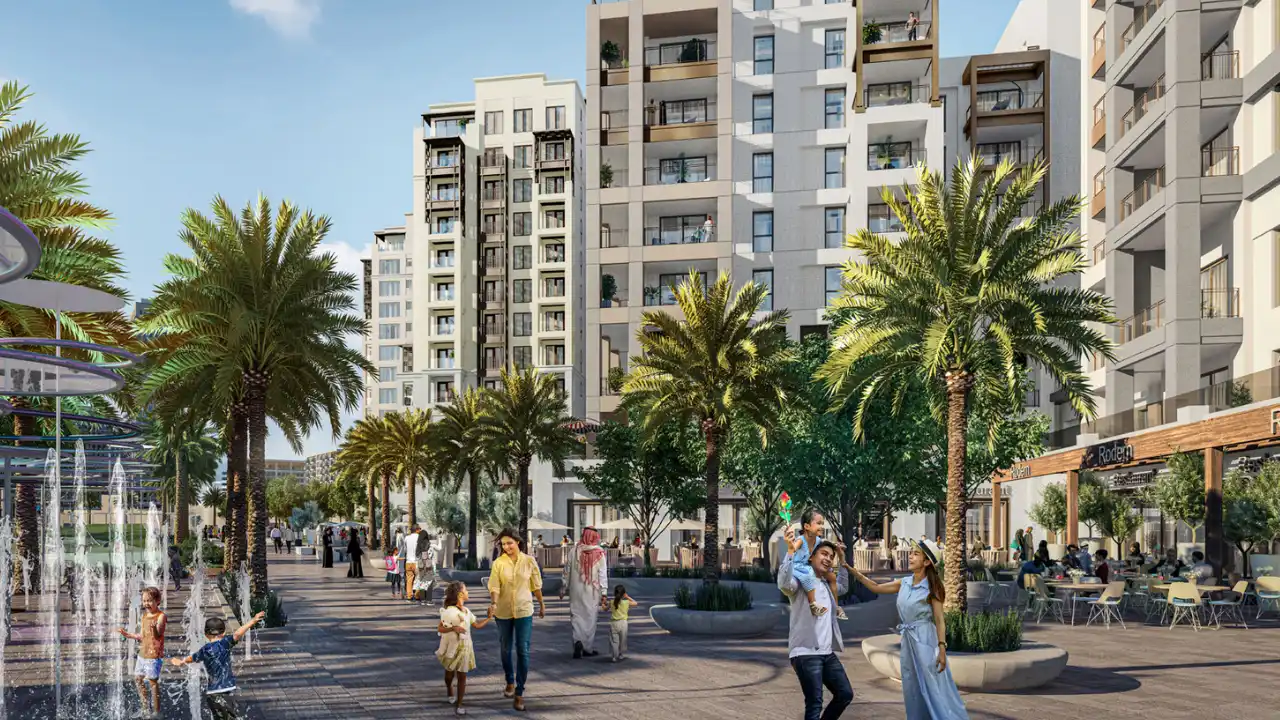 Mangrove at Dubai Creek Harbour by Emaar Properties vibrant community promenade with palm trees, water fountains, outdoor dining and residential buildings in Dubai Presented by Tohid Fetrat