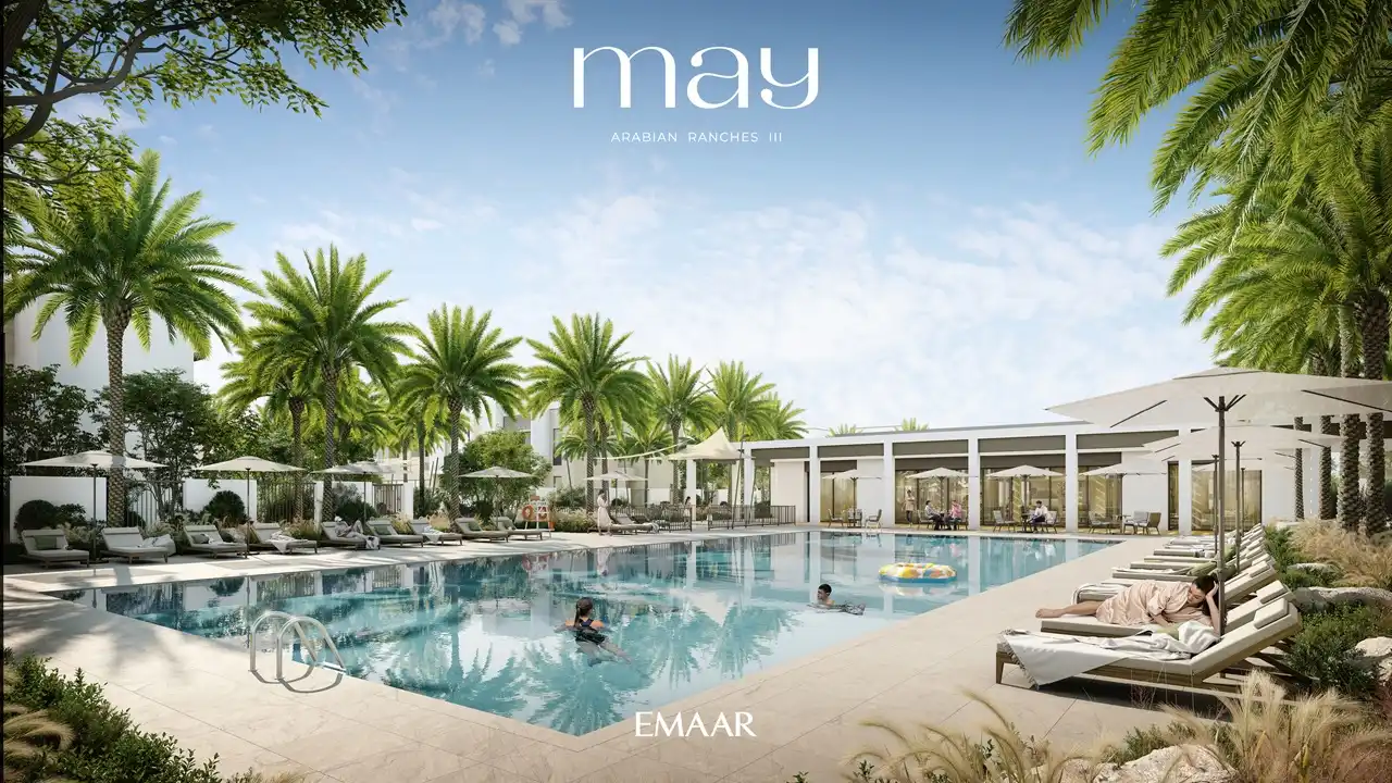 May at Arabian Ranches 3 by Emaar Properties resort style community swimming pool with sun loungers and landscaped surroundings in Dubai Presented by Tohid Fetrat