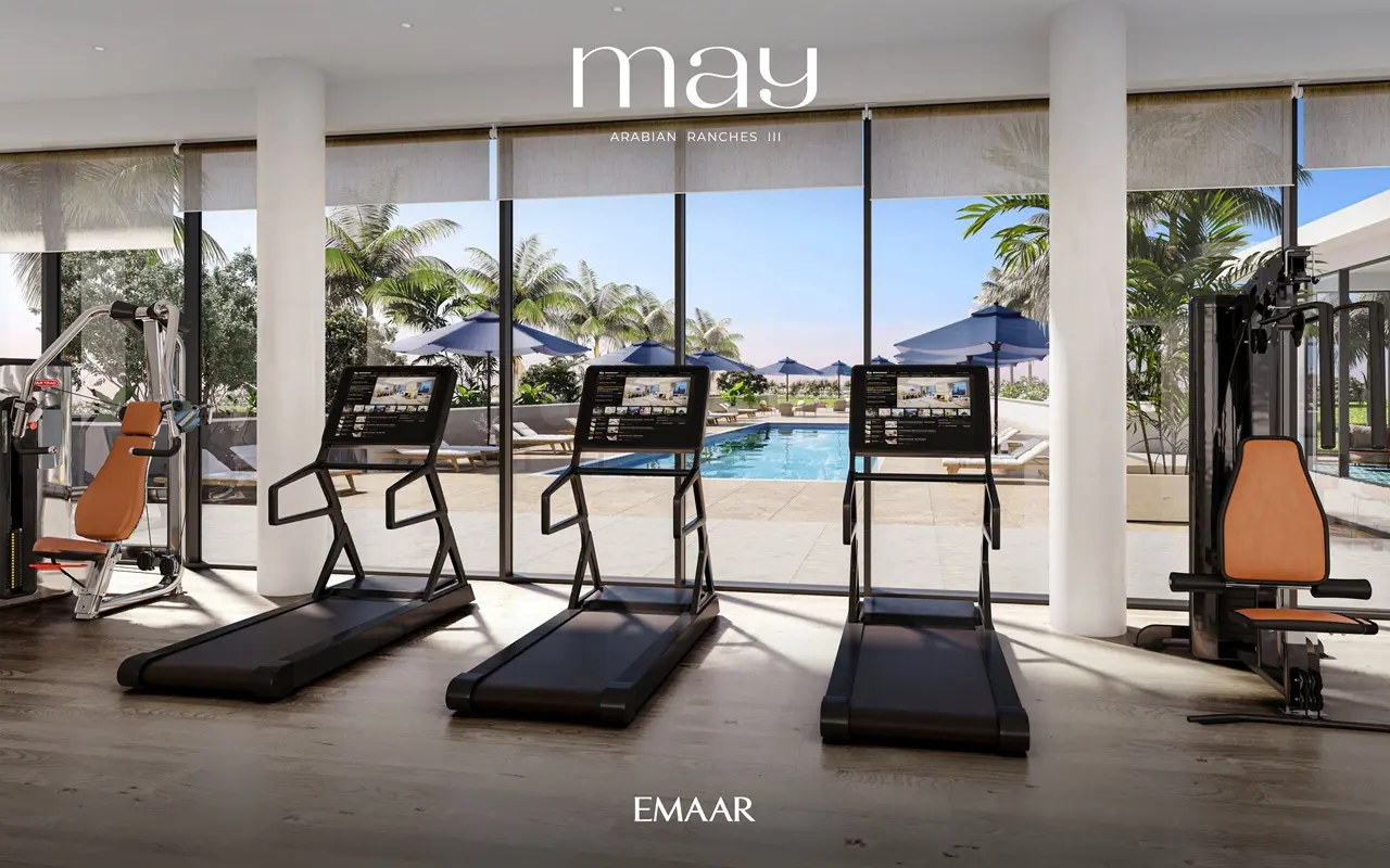 May at Arabian Ranches 3 by Emaar Properties modern fitness center with premium gym equipment overlooking the community swimming pool in Dubai Presented by Tohid Fetrat