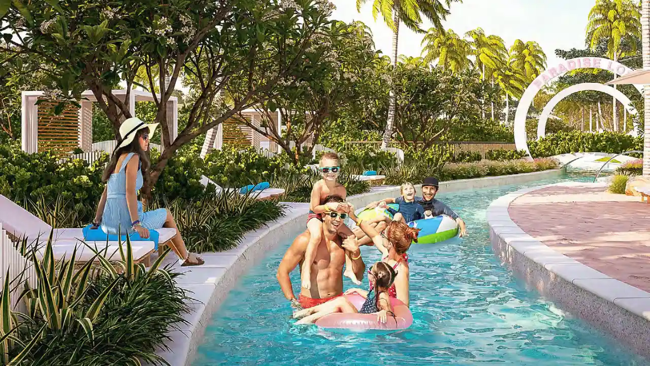 Natura at DAMAC Hills 2 by DAMAC Properties Water Town lazy river surrounded by lush landscaping palm trees and family leisure spaces in Dubai Presented by Tohid Fetrat