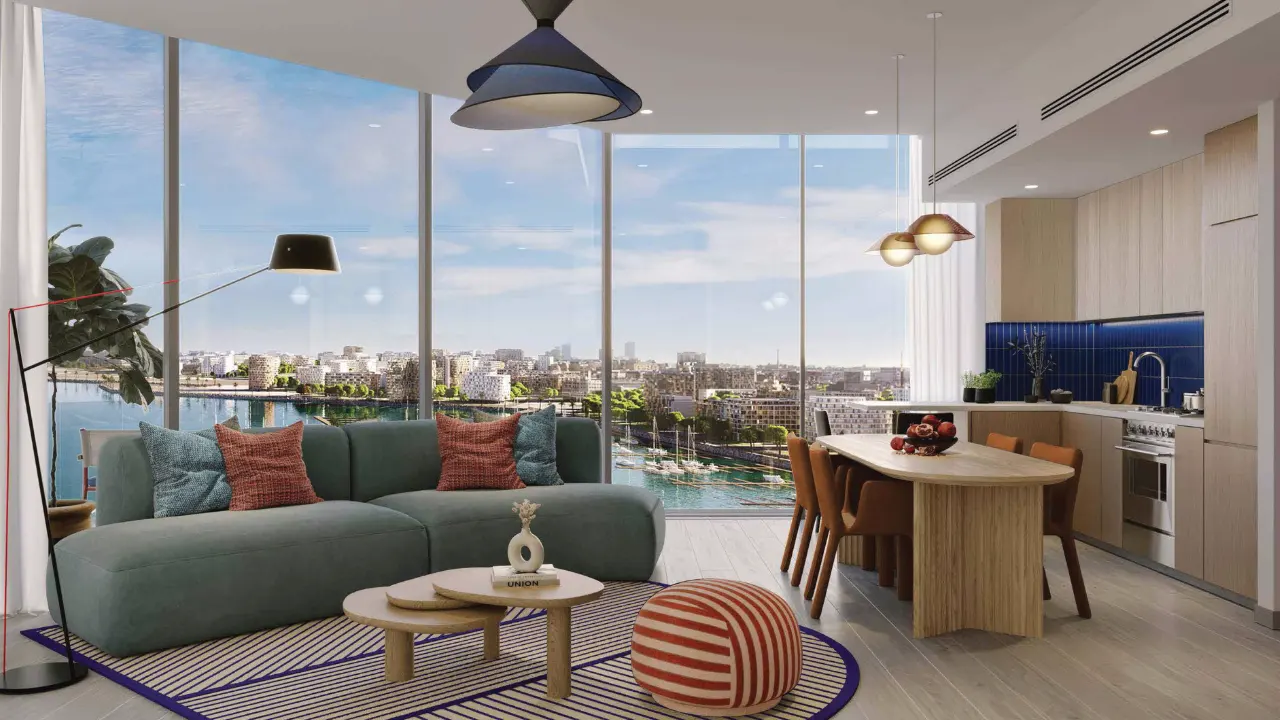 Nautica Two by Select Group in Dubai Maritime City open plan living room and kitchen with floor to ceiling windows marina views and contemporary interior design in Dubai Presented by Tohid Fetrat