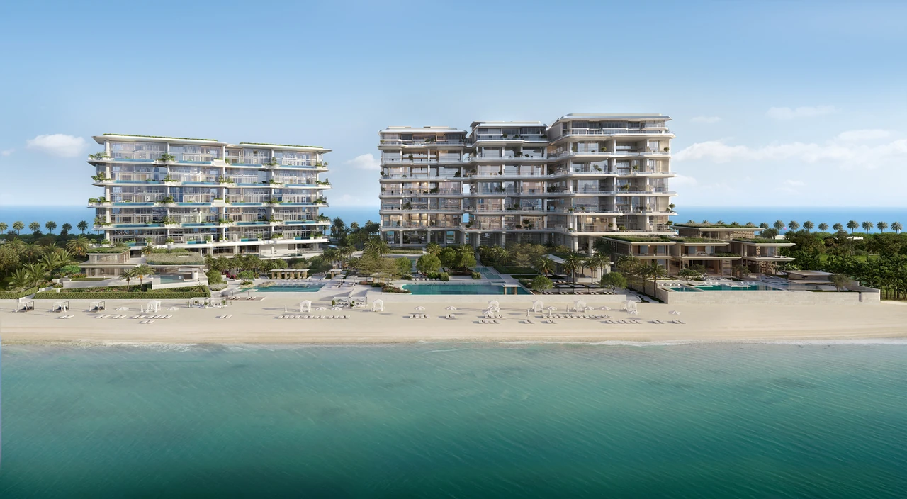 ORLA and ORLA Infinity Dorchester Collection by Omniyat beachfront panorama from the sea showing both residences shared pool decks beach cabanas and mature landscaping in Dubai - Presented by Tohid Fetrat