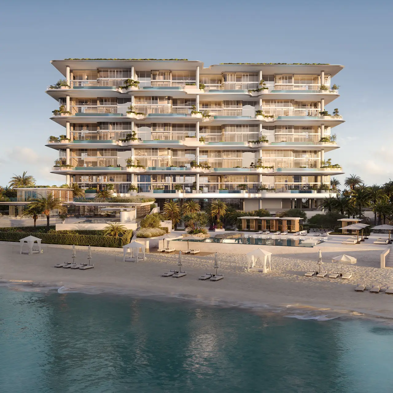 ORLA Infinity Dorchester Collection by Omniyat beachfront facade at sunset with stacked terraces private plunge pools planted balconies and beach cabanas below in Dubai - Presented by Tohid Fetrat