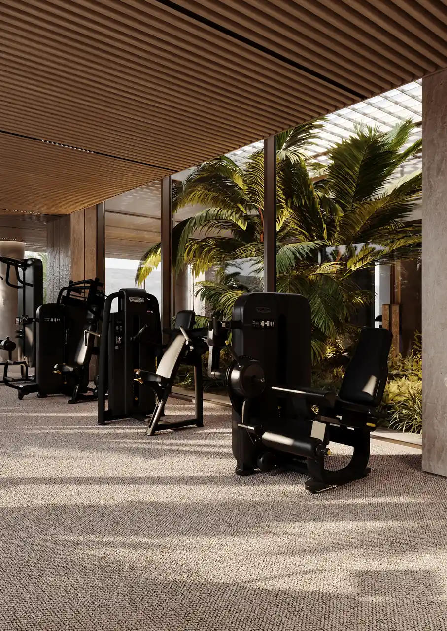 ORLA Infinity Dorchester Collection by Omniyat fitness center with resistance training machines fluted timber ceiling textured flooring and planted courtyard views in Dubai - Presented by Tohid Fetrat