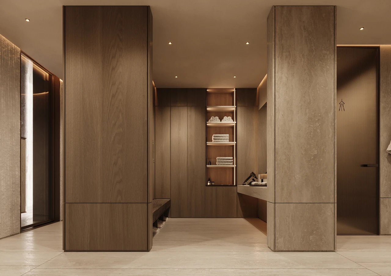 ORLA Infinity Dorchester Collection by Omniyat spa and gym locker room with full height timber joinery travertine columns bench seating and illuminated towel shelving in Dubai - Presented by Tohid Fetrat