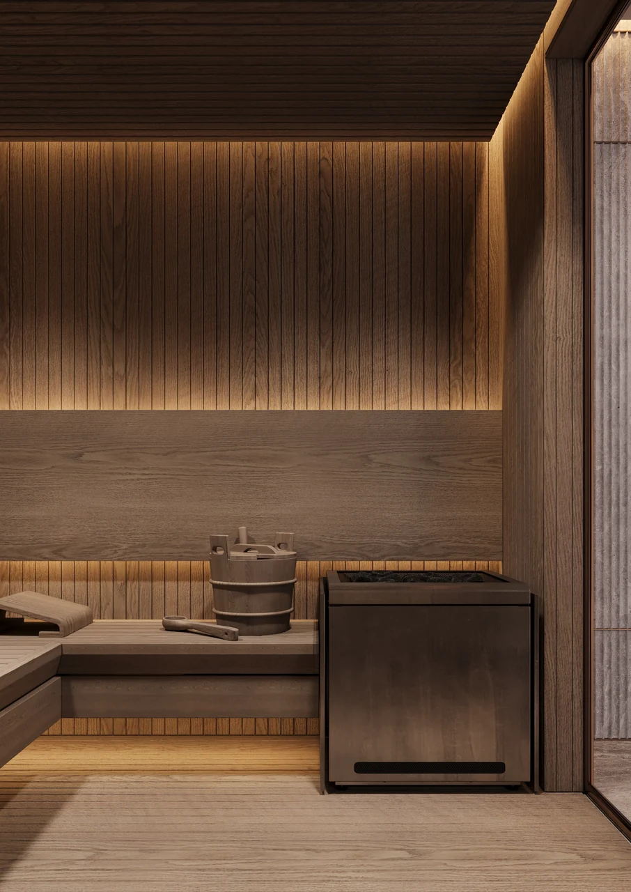 ORLA Infinity Dorchester Collection by Omniyat spa sauna with slatted timber walls tiered bench seating stone heater and warm concealed lighting in Dubai - Presented by Tohid Fetrat