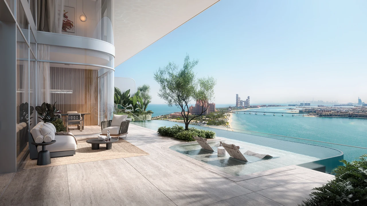 ORLA Infinity Dorchester Collection by Omniyat terrace lounge with shaded seating infinity pool marble loungers mature olive tree and panoramic Dubai coastline views in Dubai - Presented by Tohid Fetrat