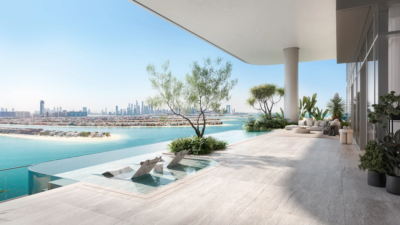 ORLA Infinity Dorchester Collection by Omniyat terrace with infinity pool marble sun loungers mature olive tree and Dubai Marina skyline across the water in Dubai - Presented by Tohid Fetrat