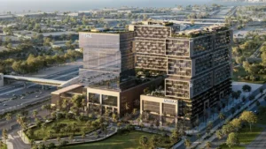 RAW District by Imtiaz in Downtown Jebel Ali aerial project view featuring residential towers, office building, landscaped podium, and metro connectivity in Dubai - Presented by Tohid Fetrat