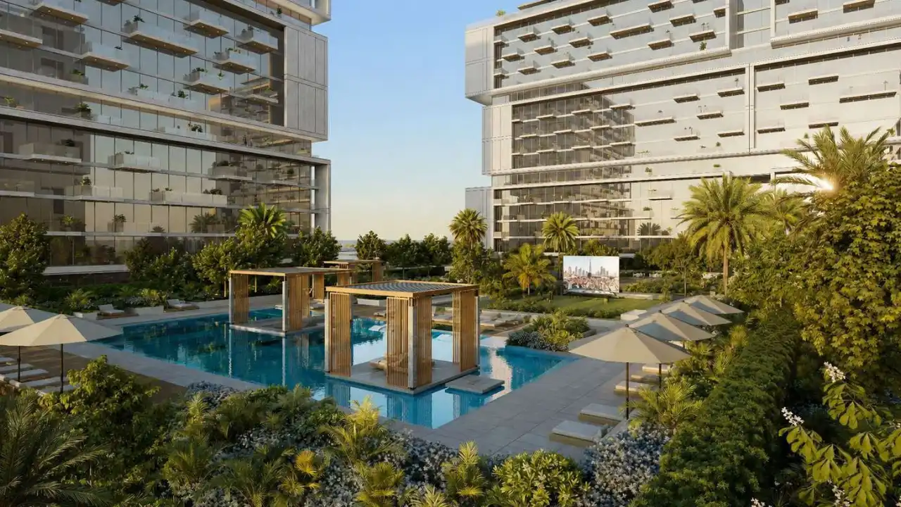 RAW District by Imtiaz in Downtown Jebel Ali resort style swimming pool with landscaped gardens, sun loungers, and luxury residential surroundings in Dubai - Presented by Tohid Fetrat