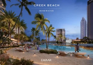 Rosewater at Dubai Creek Harbour by Emaar Properties lagoon side leisure area with swimming pool, palm trees, and waterfront residences at evening in Dubai Presented by Tohid Fetrat
