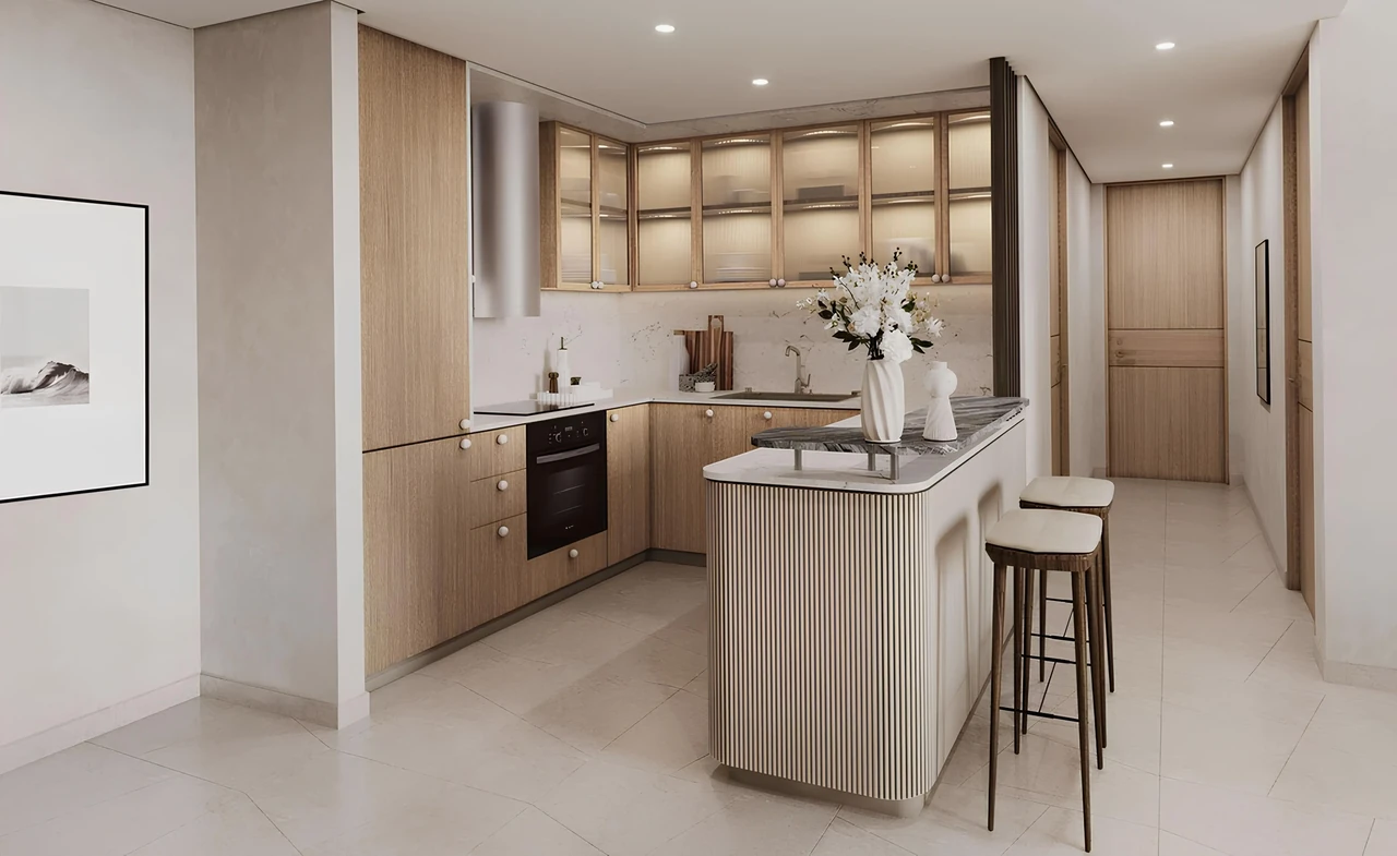 Saria by Beyond in Dubai Maritime City residence kitchen with light oak cabinetry glazed upper units a fluted breakfast bar and integrated appliances in Dubai - Presented by Tohid Fetrat
