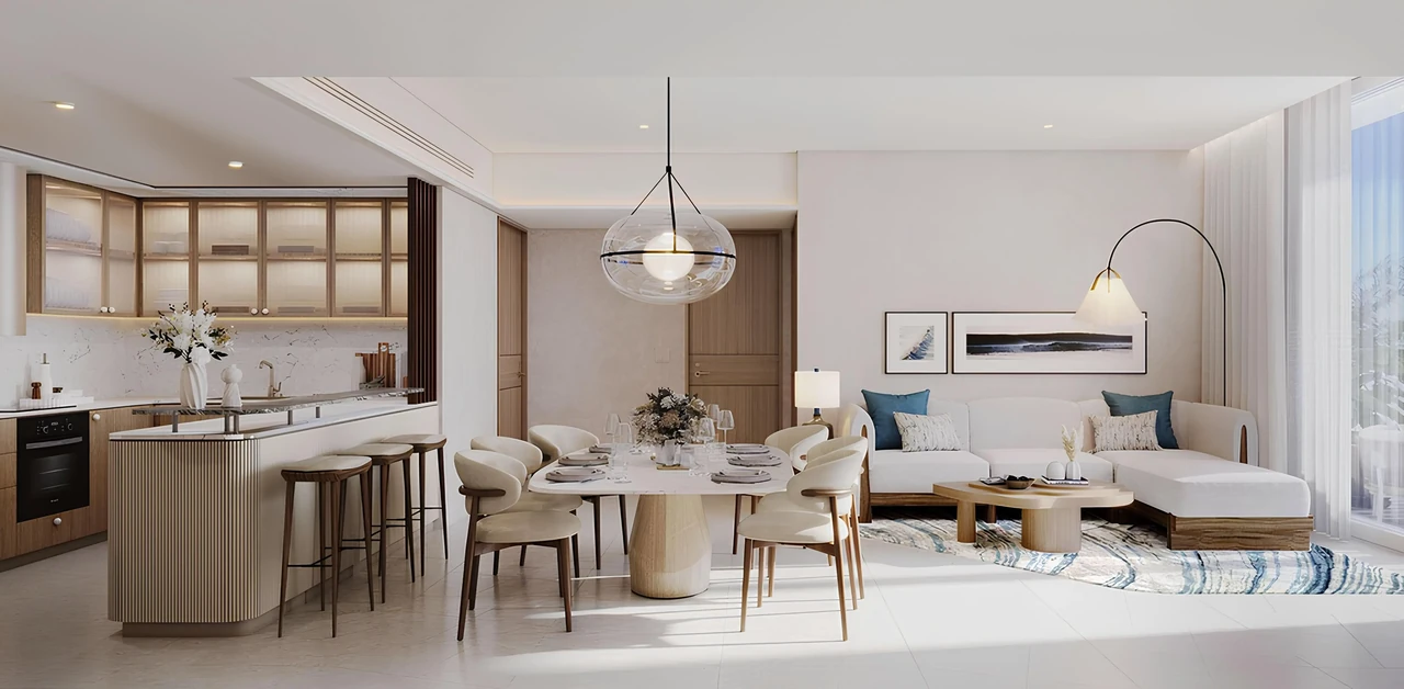 Saria by Beyond in Dubai Maritime City open plan living and dining space with island kitchen sculpted furniture and a soft neutral palette in Dubai - Presented by Tohid Fetrat