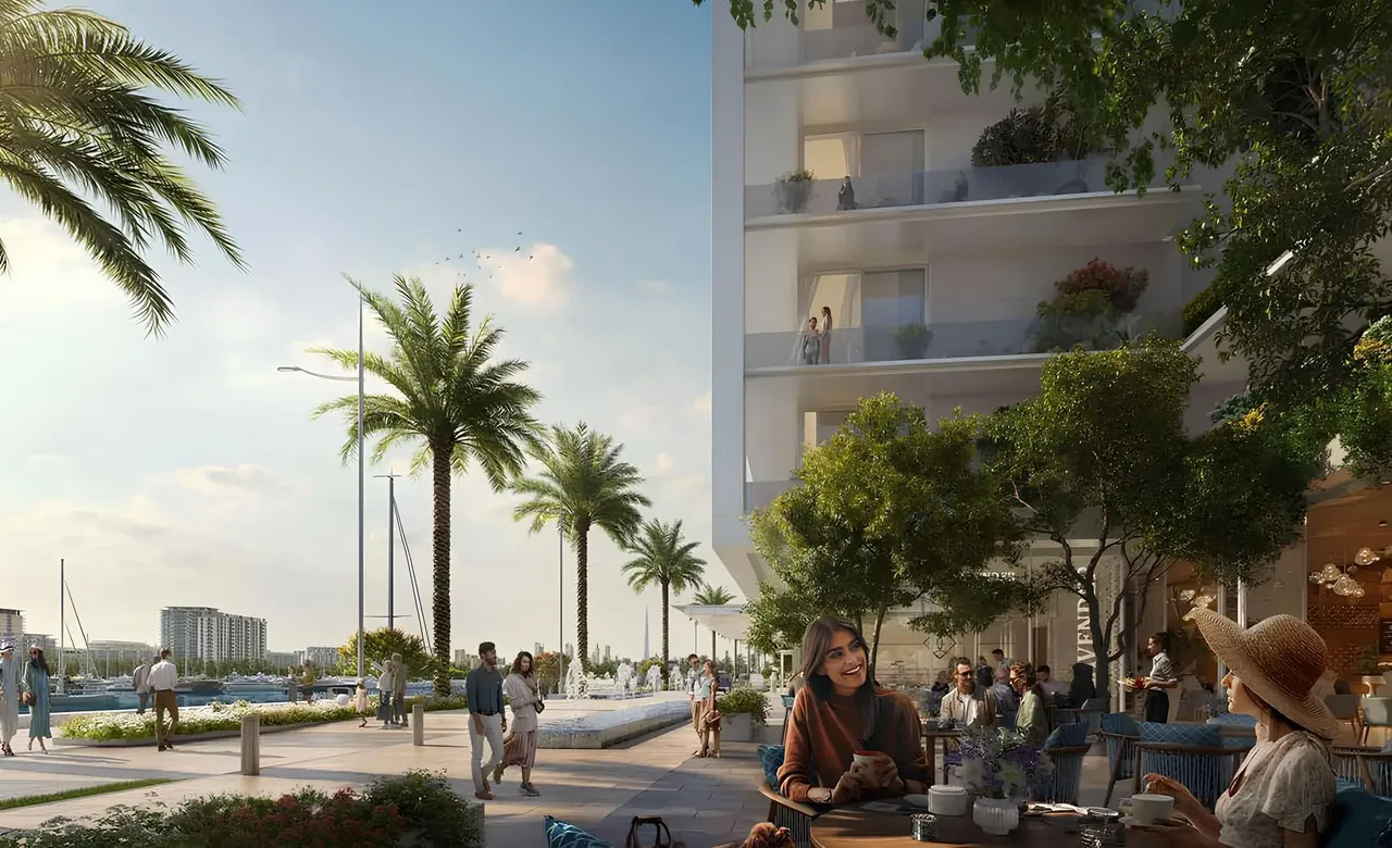 Saria by Beyond in Dubai Maritime City promenade cafe terrace beneath planted tower balconies with palm lined walkways and marina moorings in Dubai - Presented by Tohid Fetrat