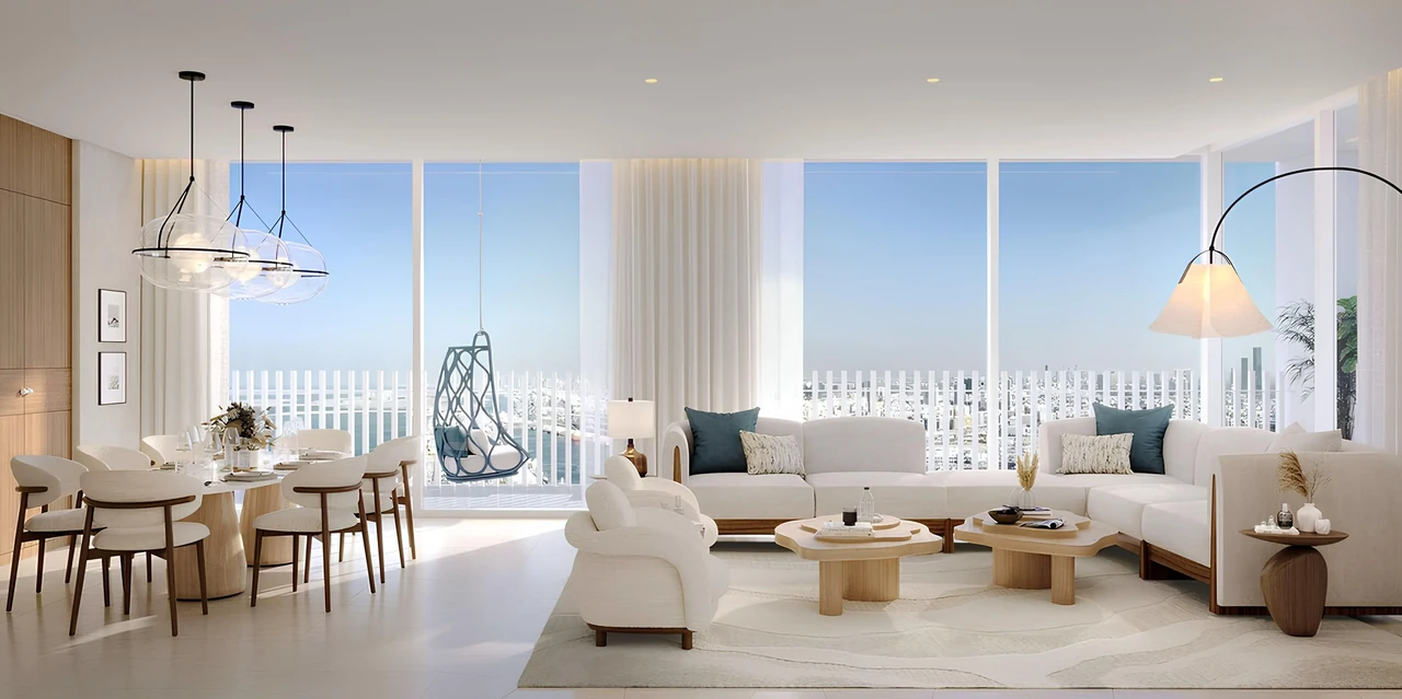 Saria by Beyond in Dubai Maritime City residence living room with corner glazing a hanging chair adjoining dining area and panoramic sea views in Dubai - Presented by Tohid Fetrat