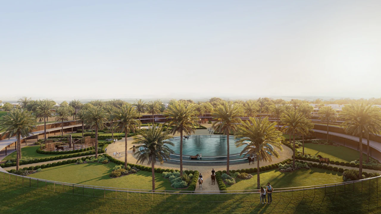 Selvara 3 at Grand Polo Club & Resort by Emaar Properties panoramic view of the equestrian stables surrounded by landscaped gardens and palm trees in Dubai Presented by Tohid Fetrat