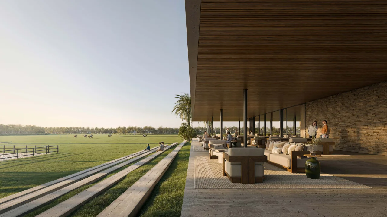 Selvara 4 at Grand Polo Club & Resort by Emaar Properties clubhouse terrace overlooking expansive polo fields with elegant outdoor lounge seating in Dubai. Presented by Tohid Fetrat