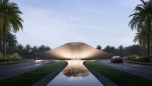 Selvara 4 at Grand Polo Club & Resort by Emaar Properties iconic entrance water feature with illuminated waterfall and landscaped boulevard in Dubai. Presented by Tohid Fetrat