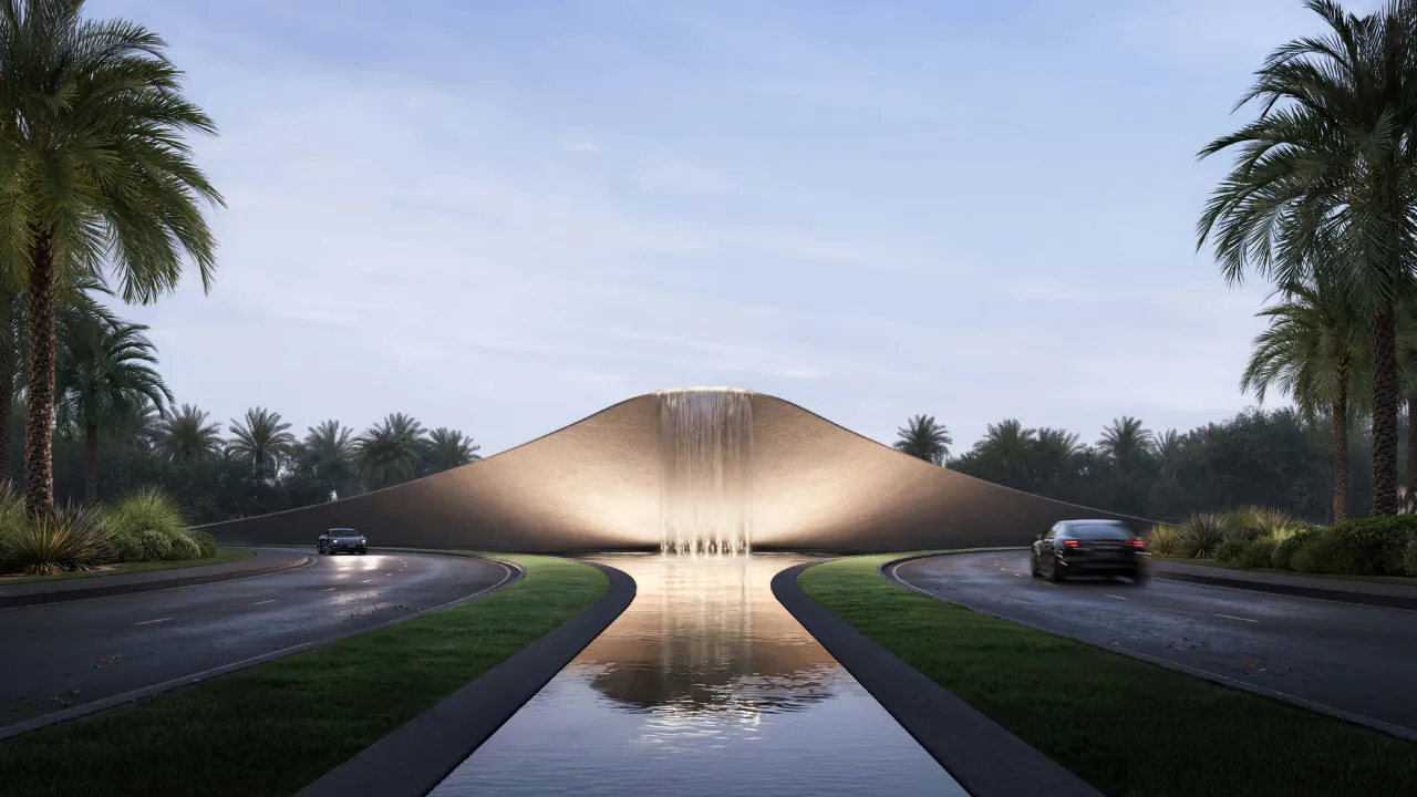 Selvara 4 at Grand Polo Club & Resort by Emaar Properties iconic entrance water feature with illuminated waterfall and landscaped boulevard in Dubai. Presented by Tohid Fetrat